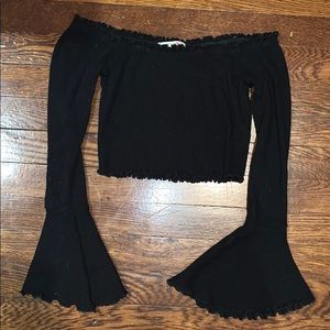 Black off the shoulder long sleeve crop top.